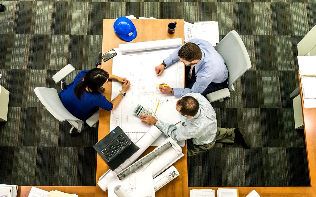 Group of diverse professionals collaborating in a modern office environment
